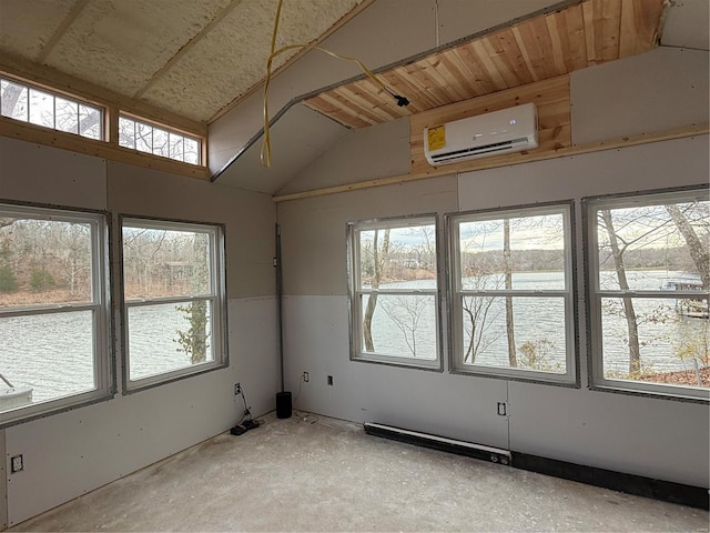 spare room with an AC wall unit and vaulted ceiling