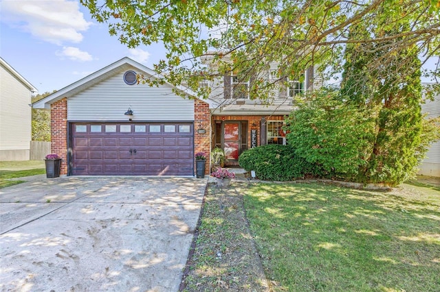 view of front of home with a front yard and a garage