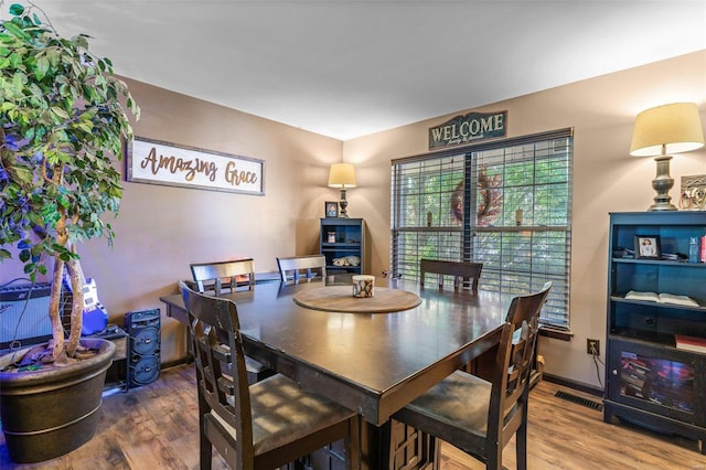 dining space featuring hardwood / wood-style flooring