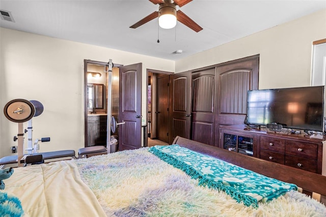 bedroom with ceiling fan and a closet