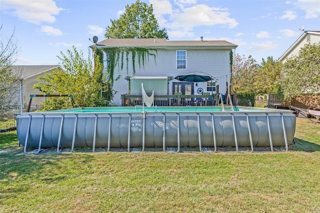 rear view of property with a lawn