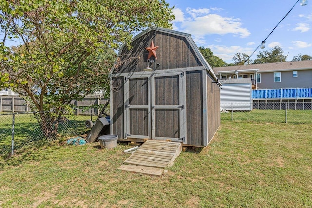 view of outbuilding with a lawn