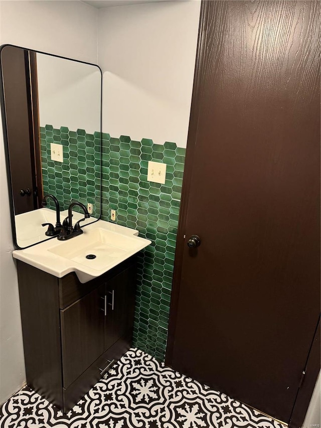 bathroom featuring vanity, tile patterned floors, and tile walls