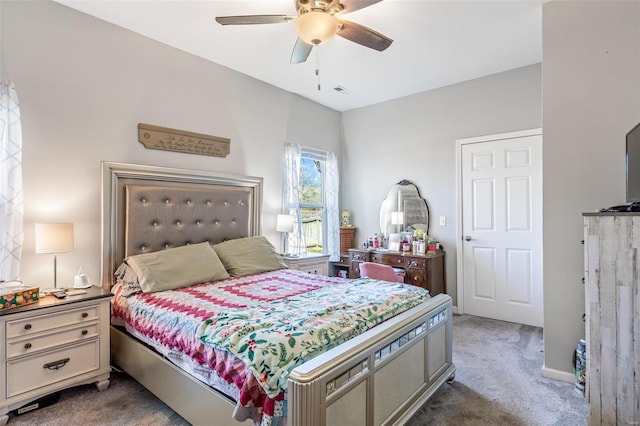 carpeted bedroom with ceiling fan