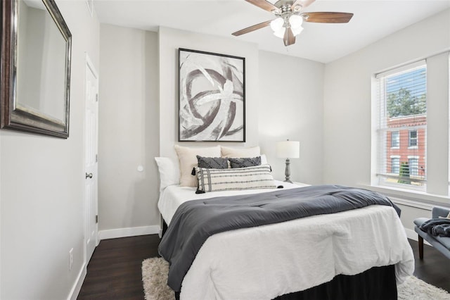 bedroom featuring dark wood-type flooring and ceiling fan