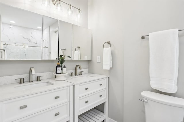 bathroom with tiled shower, vanity, and toilet