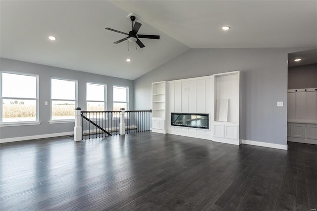 unfurnished living room featuring ceiling fan, dark hardwood / wood-style flooring, and lofted ceiling