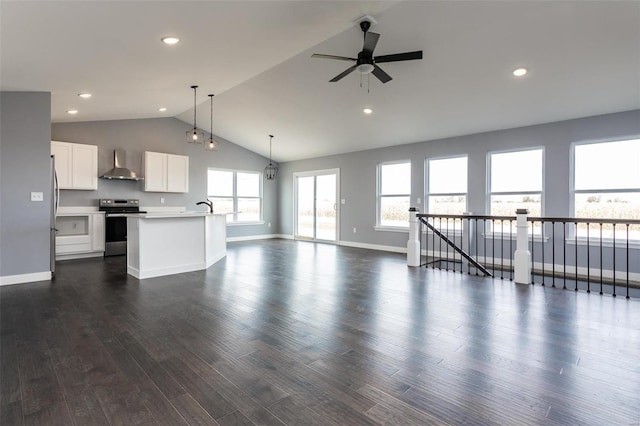 unfurnished living room with ceiling fan, dark hardwood / wood-style flooring, and vaulted ceiling