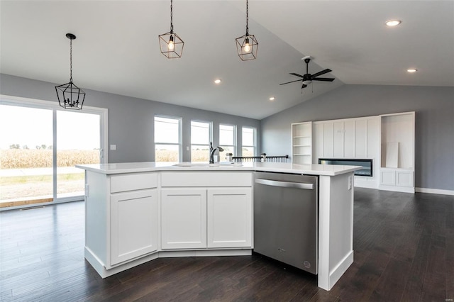 kitchen featuring stainless steel dishwasher, lofted ceiling, white cabinetry, and a kitchen island with sink