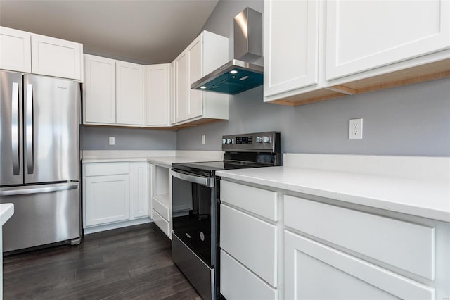 kitchen featuring white cabinets, wall chimney exhaust hood, stainless steel appliances, and dark wood-type flooring