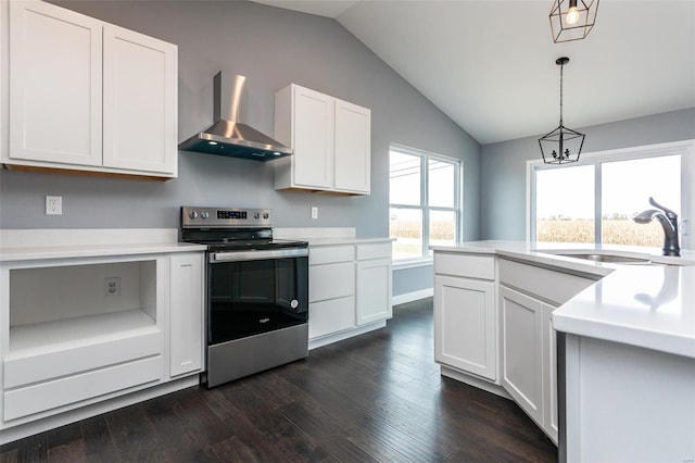 kitchen featuring sink, wall chimney exhaust hood, dark hardwood / wood-style flooring, stainless steel electric range, and white cabinets