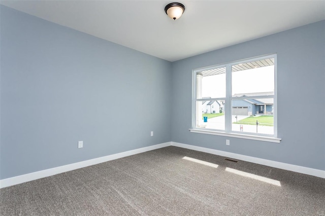 empty room with carpet flooring