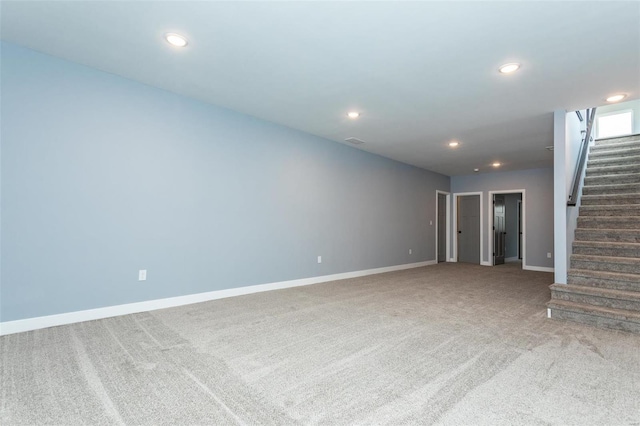 unfurnished living room featuring carpet flooring