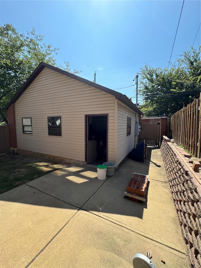 view of side of property featuring a patio area