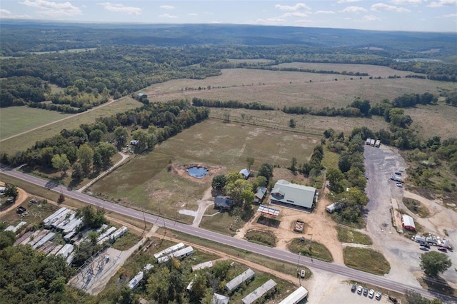 birds eye view of property featuring a rural view