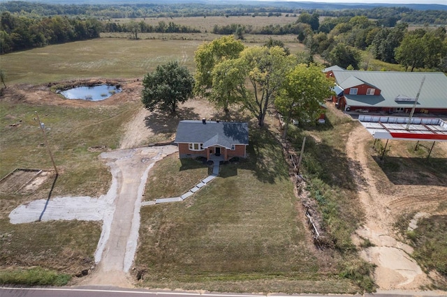 drone / aerial view featuring a rural view and a water view