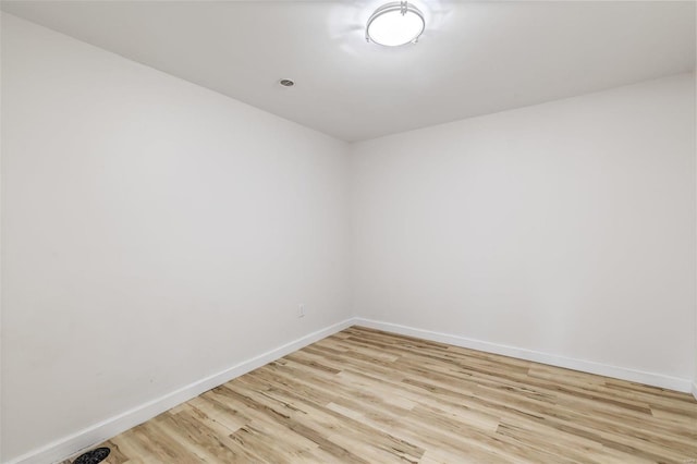 empty room with light hardwood / wood-style floors