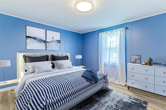 bedroom with light wood-type flooring