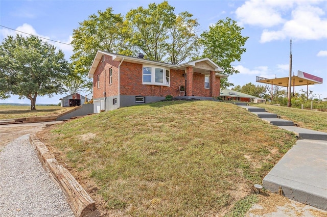 ranch-style house with brick siding and a front lawn