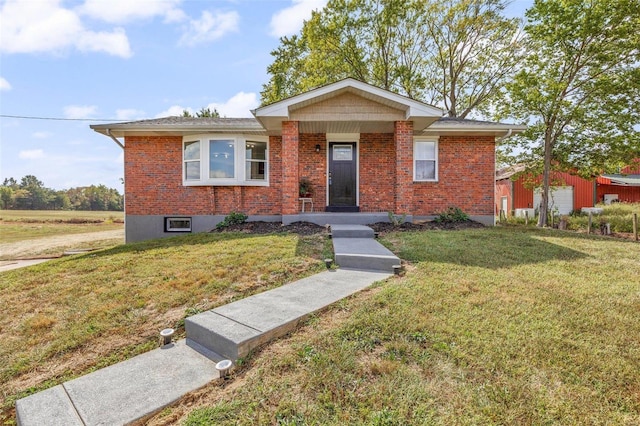 view of front of house with a front lawn and brick siding