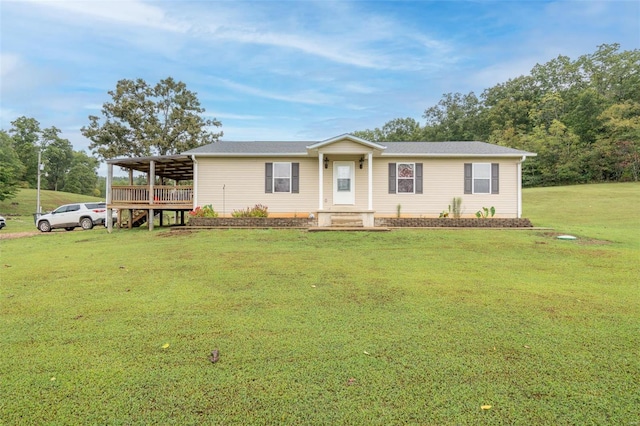 view of front of property with a front lawn and a deck