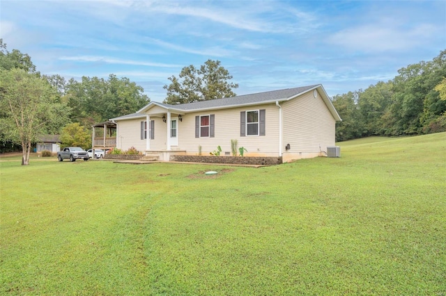 single story home featuring central AC unit and a front yard