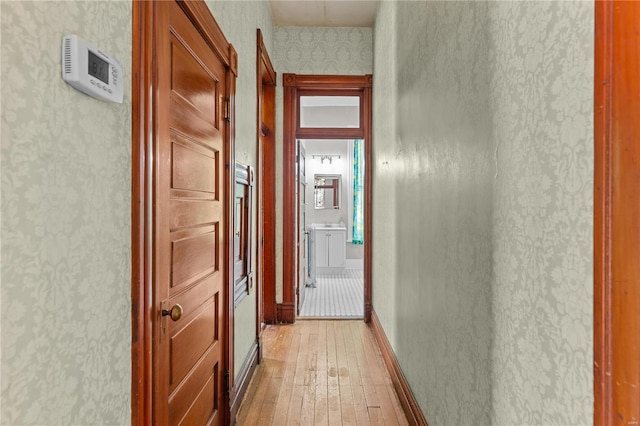 corridor featuring wood-type flooring