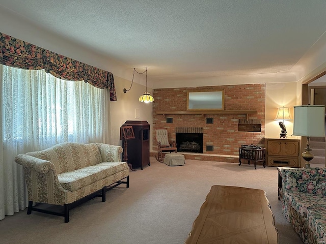 carpeted living room with a brick fireplace, a textured ceiling, and brick wall