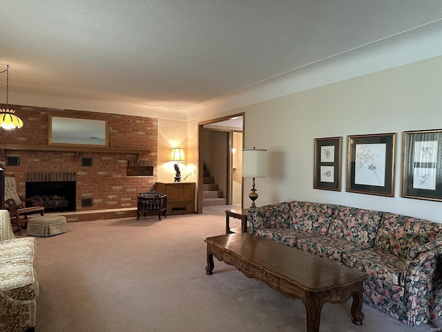 carpeted living room featuring a textured ceiling, a fireplace, and brick wall