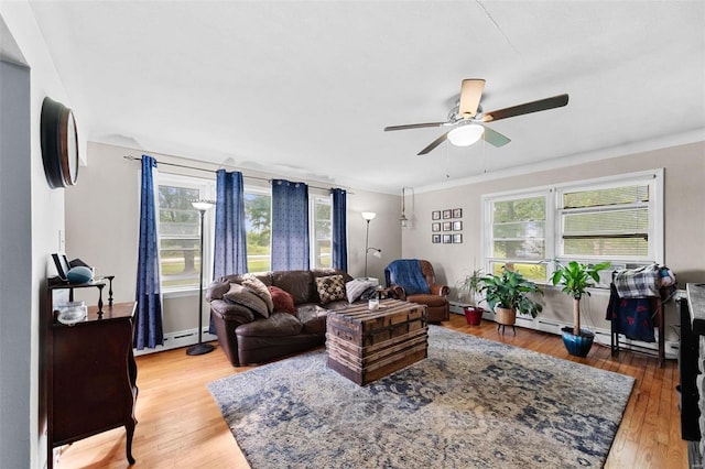 living room featuring a baseboard radiator, ceiling fan, and hardwood / wood-style flooring