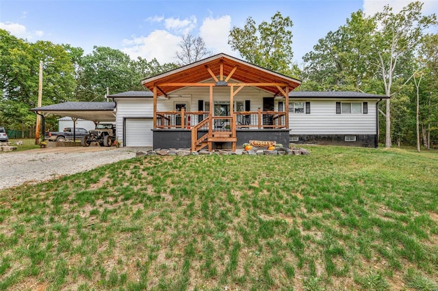 view of front of home featuring a deck, a carport, covered porch, an outdoor structure, and a front yard