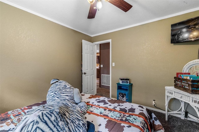 bedroom with ornamental molding, ceiling fan, and carpet flooring