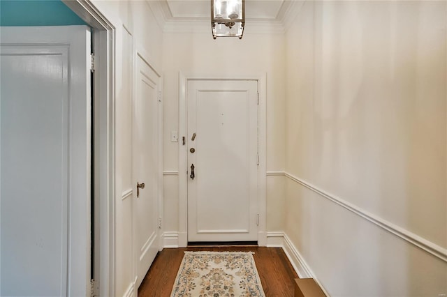 entryway with dark hardwood / wood-style flooring and ornamental molding