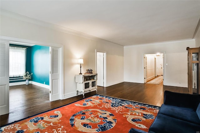 living room featuring dark hardwood / wood-style floors and ornamental molding