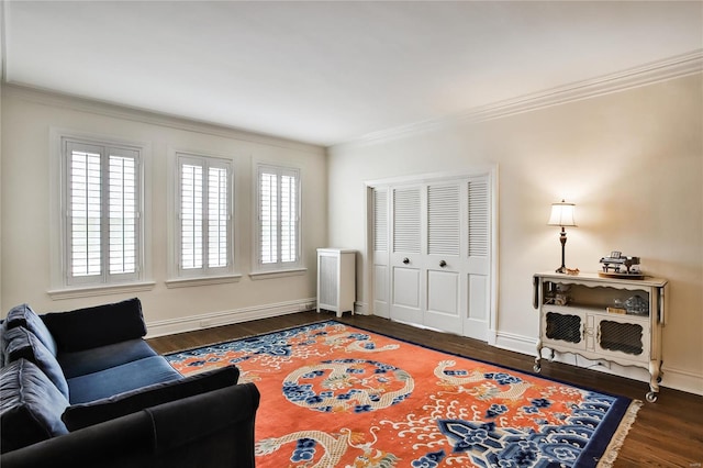 living area featuring ornamental molding and dark wood-type flooring