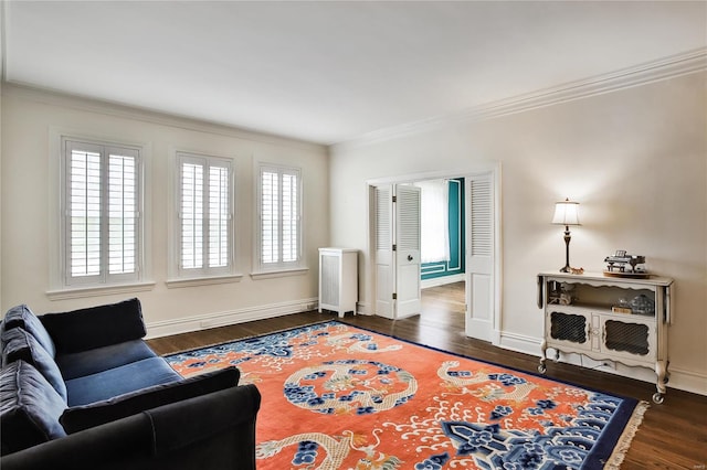 living room featuring crown molding and dark wood-type flooring