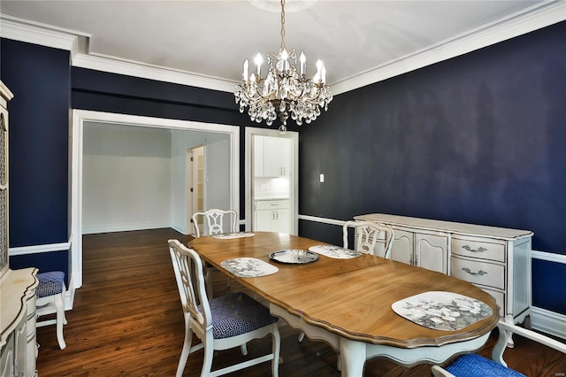 dining room with a chandelier, dark wood-type flooring, and ornamental molding