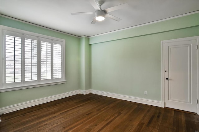 spare room featuring ceiling fan and dark wood-type flooring