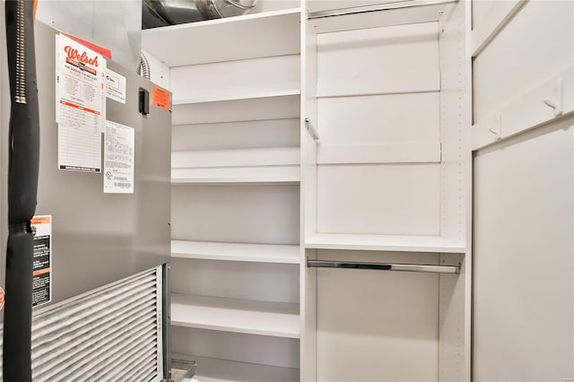 walk in closet featuring heating unit