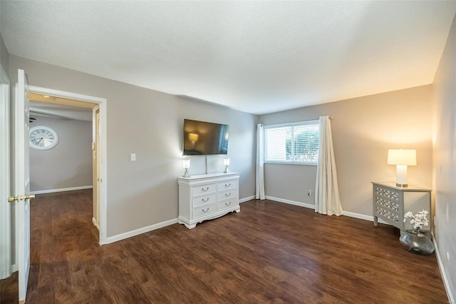 unfurnished bedroom featuring dark wood-type flooring