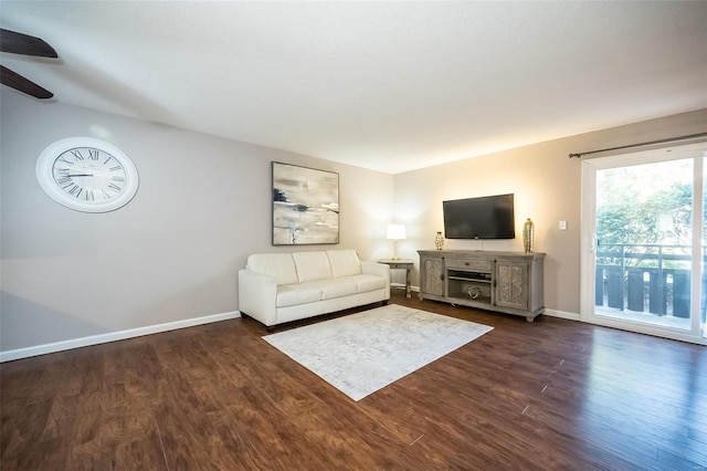 unfurnished living room with dark hardwood / wood-style floors and ceiling fan