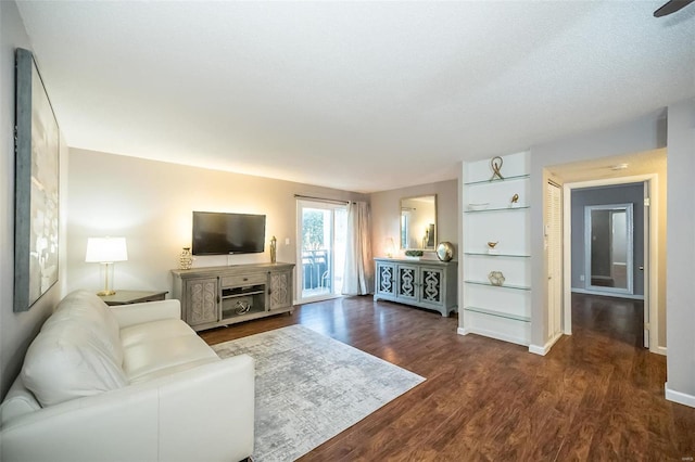 living room with dark wood-type flooring