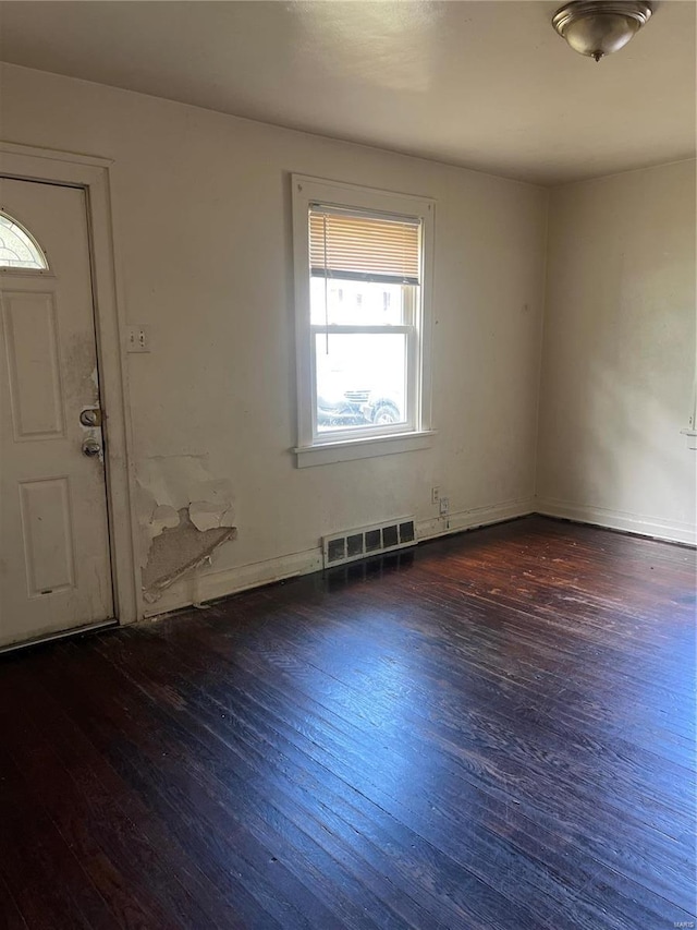 unfurnished room featuring dark hardwood / wood-style floors