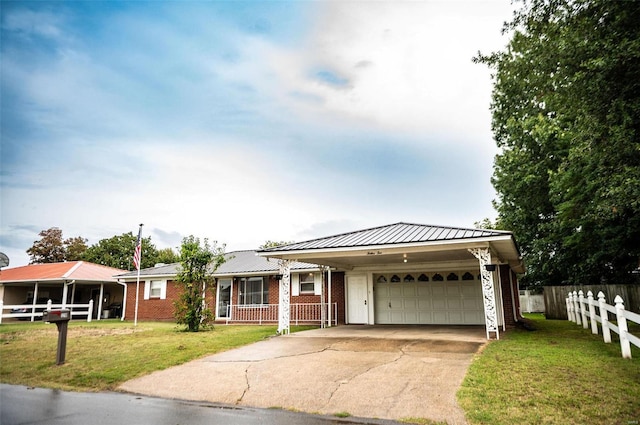 view of front of house with a garage and a front lawn