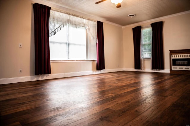 unfurnished living room featuring heating unit, crown molding, dark wood-type flooring, and a textured ceiling