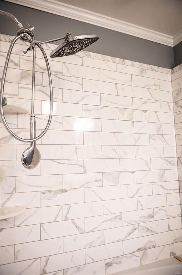 details featuring tiled shower and ornamental molding