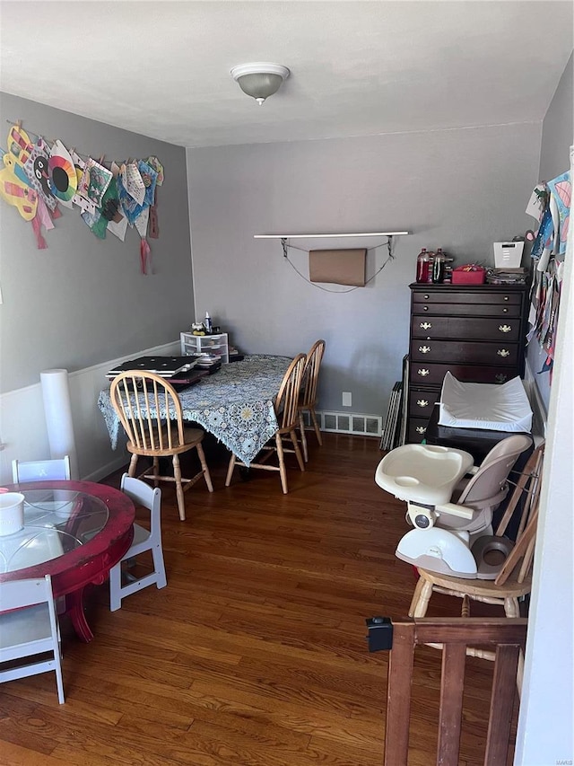 dining room with dark wood-type flooring