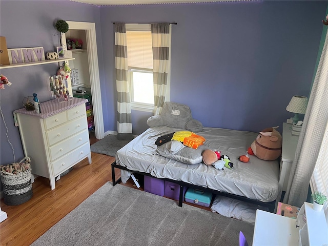 bedroom featuring light wood-type flooring