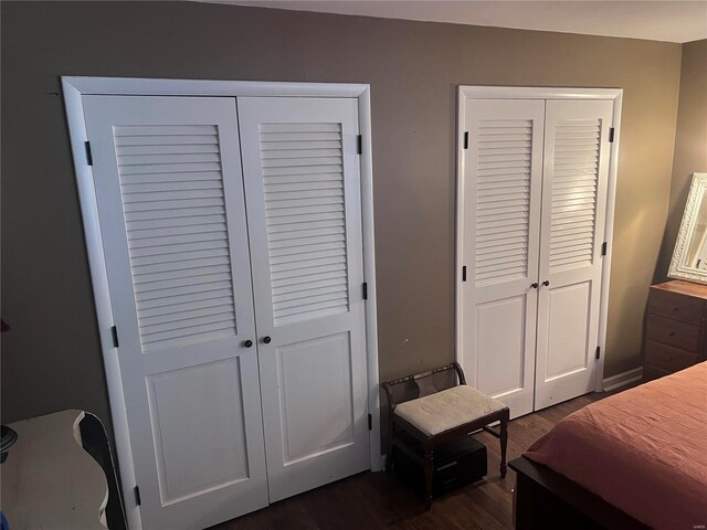 bedroom with dark wood-type flooring