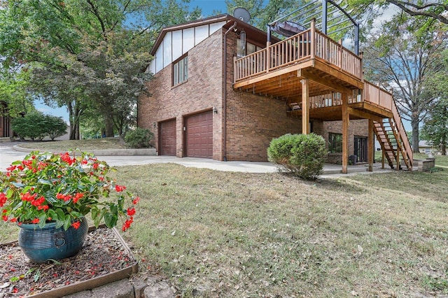 view of side of property featuring a lawn, a wooden deck, and a garage